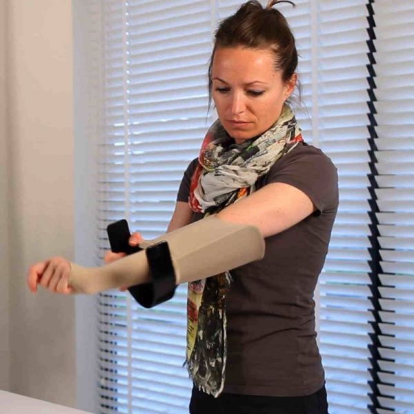  woman puts on her arm sleeve with donning device Steve EasyON